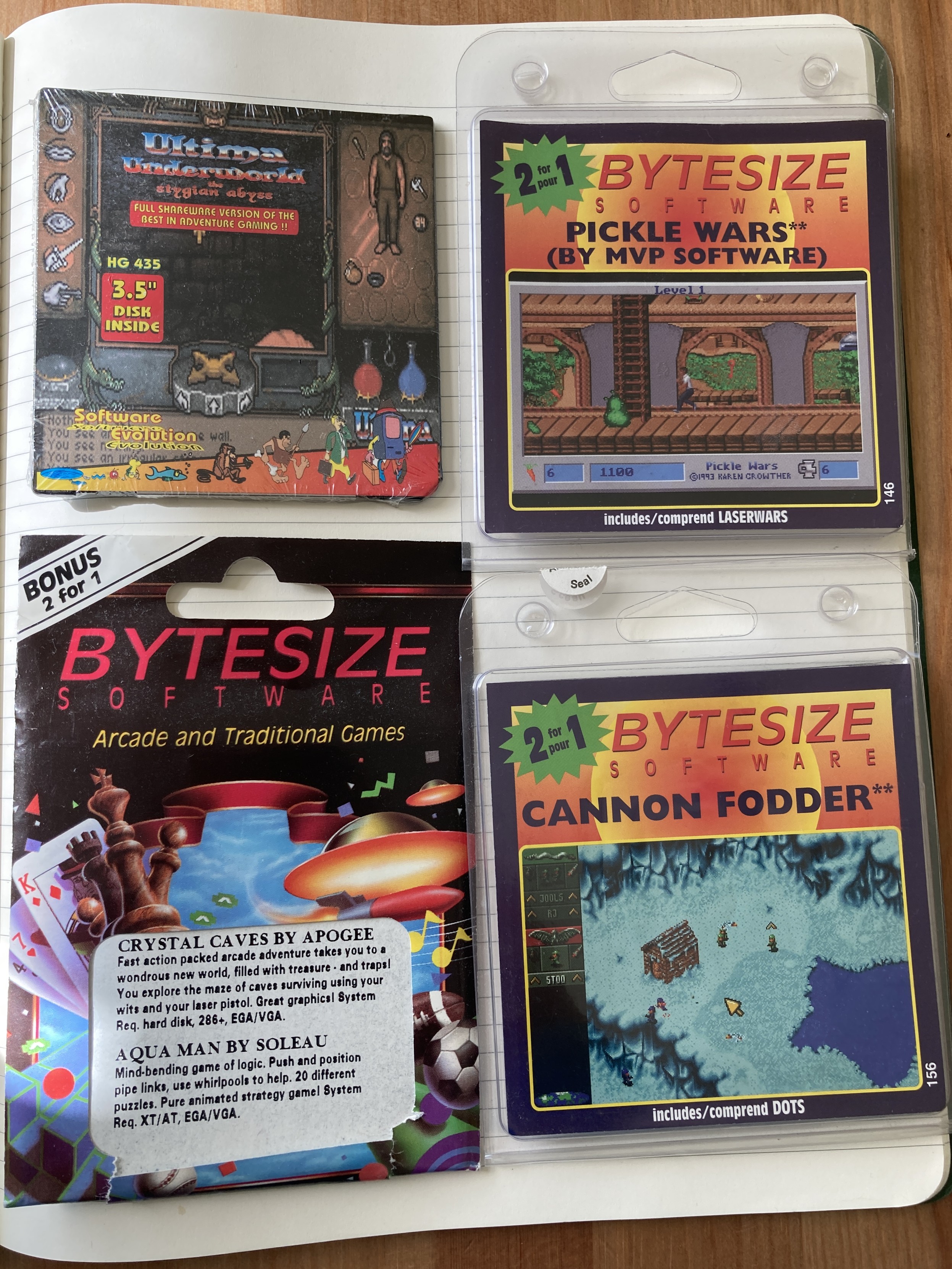 A photo of four shareware diskettes.

Clockwise, from top left:

Ultima Underworld Demo (Origin Systems)

Pickle Wars (MVP Software)

Crystal Caves (Apogee) and Aqua Man (Soleau)

Cannon Fodder (Sensible Software)