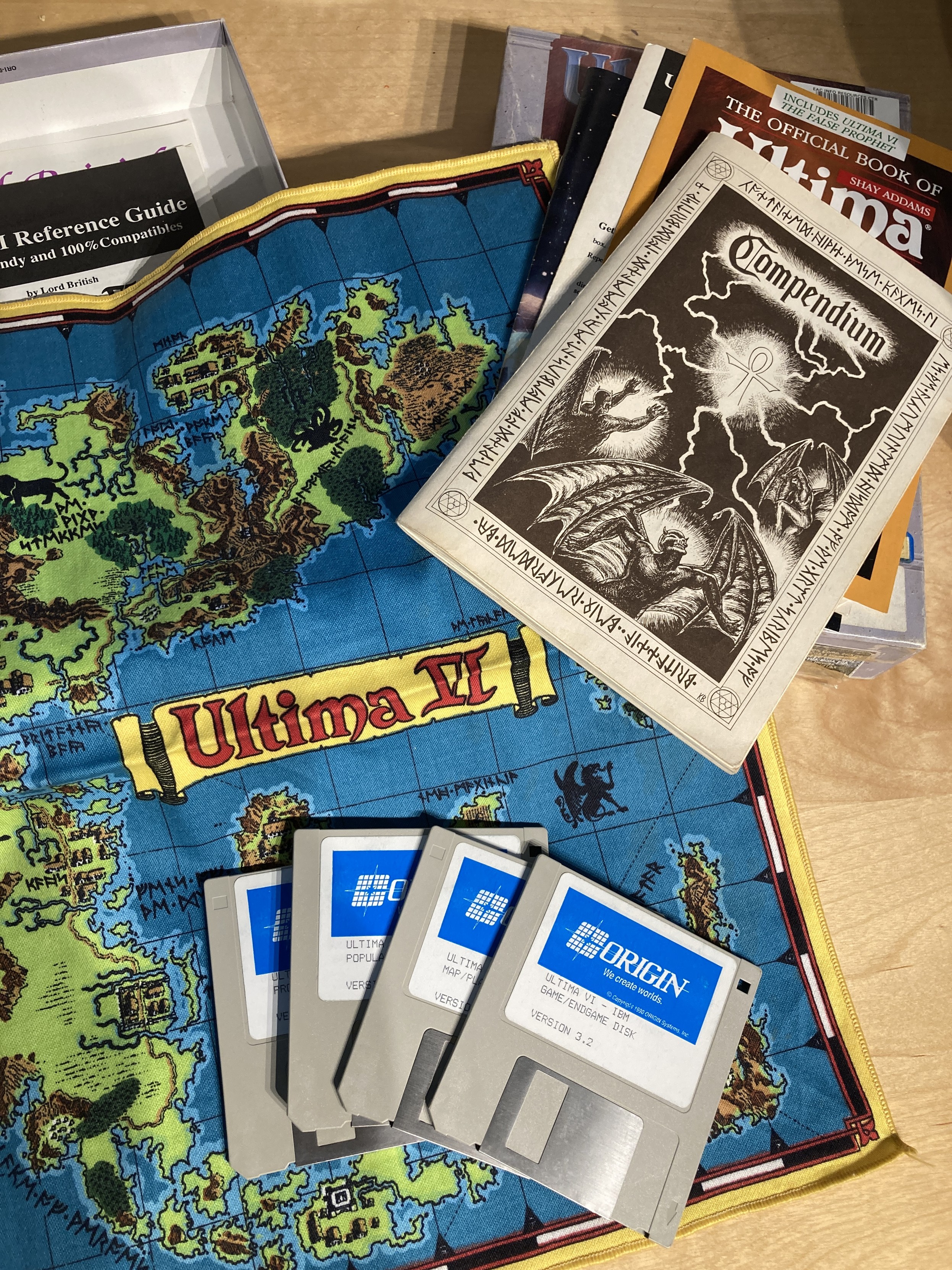 The cloth map, compendium and diskettes for Ultima VI.